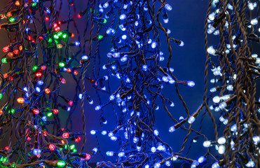 Glowing Christmas garlands. Background with christmas light.