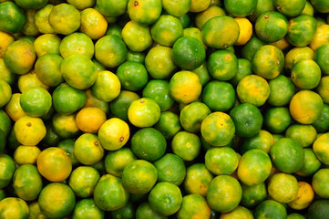 Orange and green mandarins in a street market in Istanbul.