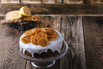 Christmas cake decorated with candied lemon slices on  citrus glaze