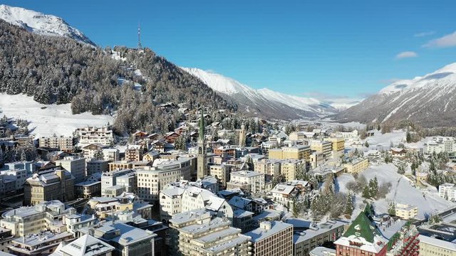 Village of Sankt Moritz, famous place in Engadine. Winter in the Swiss Alps. Aerial view 4k