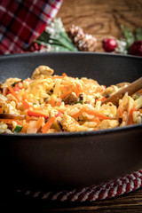 Fried rice with chicken served in a wok.