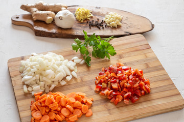 table with chopped vegetables. Ingredients for a curry recipe