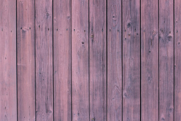 Fototapeta premium Wooden wall background in pink tone