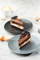 Banana chocolate cake on gray plate on marble background. Selective focus. Vertical photo. Menu for bakery. cafe menu. Pastry. Delicious and sweet dessert at cafe restaurant.