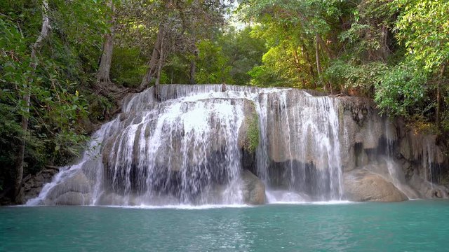 zoom out video of Erawan water fall (Second floor), tropical rainforest at Srinakarin Dam, Kanchanaburi, Thailand. Beautiful waterfall in Thailand. 