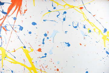 texture of multi-colored paint splashes on white background