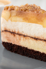 pear chocolate cake on gray plate on marble background. Selective focus. Vertical photo. Menu for bakery. cafe menu. Pastry. Delicious and sweet dessert at cafe restaurant.