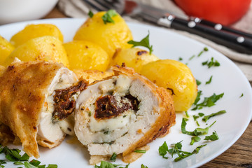 Chicken breast stuffed with cheese and dried tomatoes.