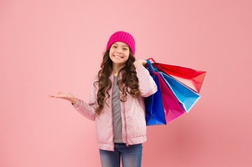 Best deal. Sales and discounts. Little girl with gifts. Winter shopping. Buyer consumer concept. Christmas sale. Kid fashion. Holiday purchase saving. Home shopping. Small girl with shopping bags