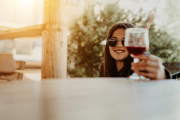 Modern attractive woman drink cocktail in coffee shop