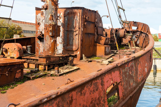 Old ship ready to be recycled in harbor