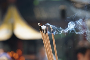 Suzhou,China-September 14, 2019: Joss sticks held by worshippers at Candles at Hanshan Temple in Suzhou, China