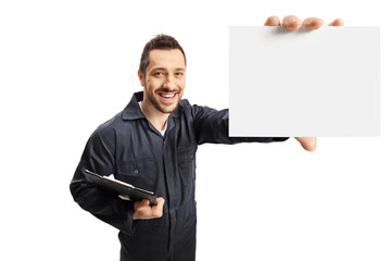 Mechanic with a clipboard showing a blank card