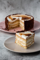 Delicious victoria sponge cake with white cream on plate on table on marble background. Wallpaper for pastry cafe or cafe menu. vertical.