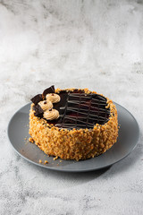 Delicious cake on plate on table on marble background. Wallpaper for pastry cafe or cafe menu. vertical.