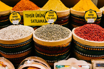 Multi colored turkish spices standing in rows at the bazaar in Istanbul, Turkey.