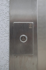 metal button to call the Elevator in the house