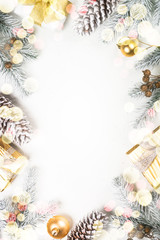 Christmas background with fir tree and decorations on white.