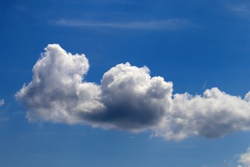 Naklejka na ściany i meble Dramatic blue sky with clouds