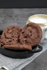 Chocolate chips cookies with a cup of milk