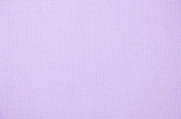 Fabric texture close-up. Natural fabric. Pink background.