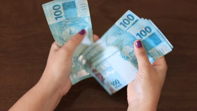 female hand counting Real banknotes