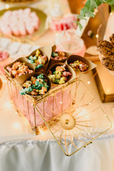 Candy bar beautifully decorated with sweets in a vintage event.