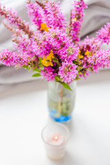 Pink flowers and candle