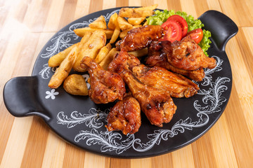 Chicken wings in sweet and sour sauce.