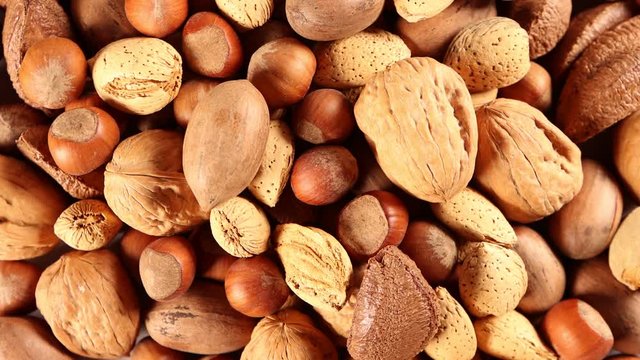  Unshelled nuts 4k video spinning clockwise slowly top down view.