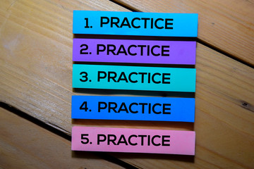 Practice. Practice. Practice. Practice. Practice text on sticky notes isolated on the tables