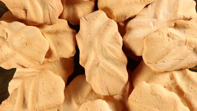 Uraro arrowroot cookies 4k video spinning clockwise slowly top down view.