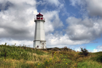 Fototapeta na wymiar Lighthouse near Louisbourg Cape Breton NS