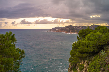 storm in the mediterranean sea at sunset