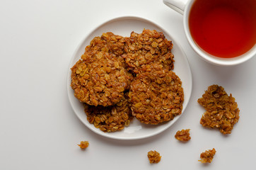 Pumpkin vegan oatmeal cookies with nuts on white background