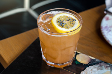 Fresh lemon alcohol cocktail at a restaurant interior 