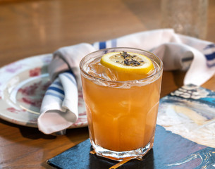 Fresh lemon alcohol cocktail at a restaurant interior 