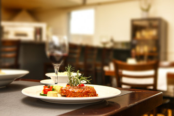 steak with tomtao and pepper mit in background