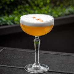 fresh orange alcohol cocktail at a restaurant interior 