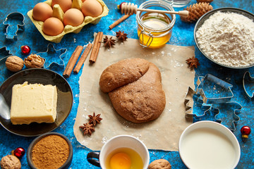 Gingerbread dough placed among various ingredients. Christmas baking concept