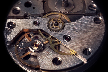 vintage old mechanism with gears and springs, clock mechanism close-up macro
