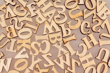 wooden letters of the English alphabet workpiece closeup macro