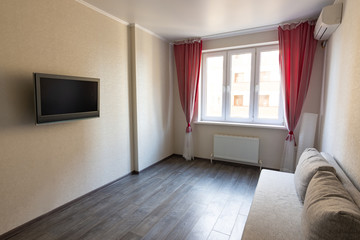 Interior of a modest room in an apartment for rent