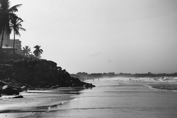 Black and white beach view with fog in background
