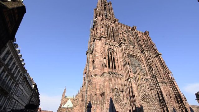 Strasbourg, France.August 2019. Our Lady's magnificent cathedral, with its 142 meters of height, was for comparison time for taller buildings. The reddish fa&ccedil;ade is impressive. Tilt movement.