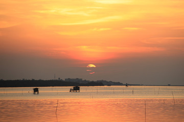 Orange asky with Sunset over sea 