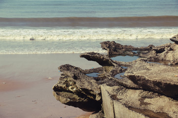 Rock and sea view from beach in morning