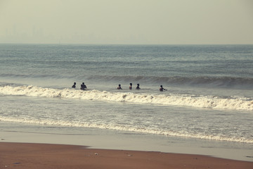 Kids playing in sea waves