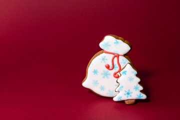 gingerbread cookie of Santa's bag on red background. Traditional Christmas food. Christmas and New Year holiday concept. Copyspace