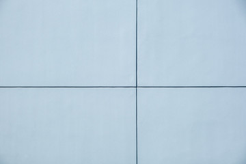 Concrete wall panels divided into four sections with copy space